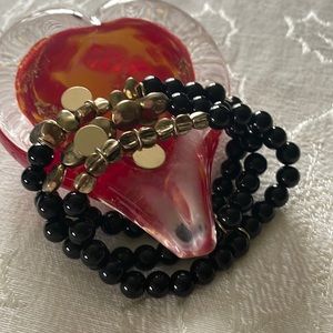 Three Strand Stretchy Bracelet With Black Beads and Gold Accents